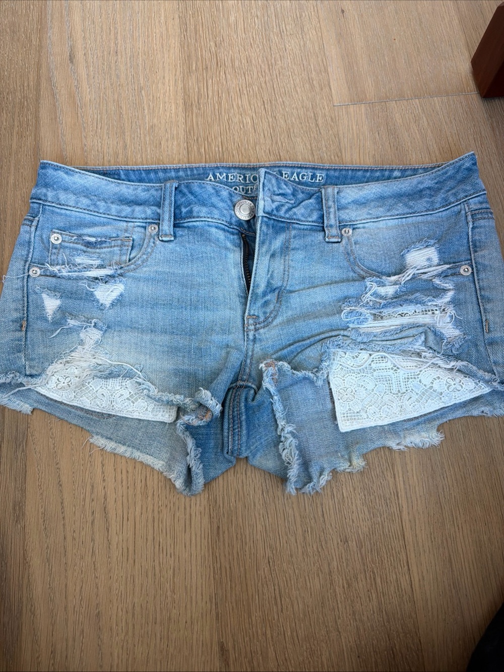 American Eagle Outfitters Light Blue Distressed Denim Shorts with Lace Insets